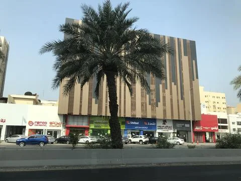 The dates tree front of the building Stock Photos