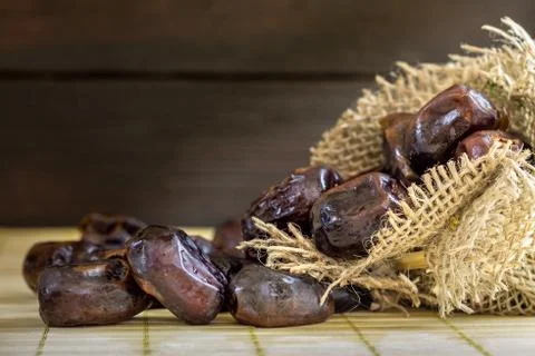 Dates on wooden background Stock Photos