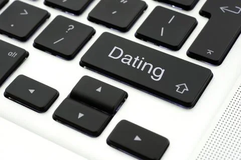 Dating button on laptop Stock Photos