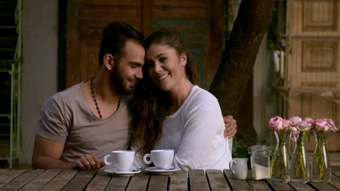 Dating couple smiling at camera while at coffee cafe. Stock Footage 199632966