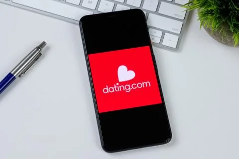Dating.com app logo on a smartphone screen Stock Photos