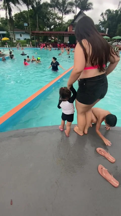 Daughter Accidentally Pulled Into Pool, Joinville, Brazil - 03 Dec 2023 Stock Footage 258590076