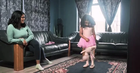 Daughter dancing with doll while mom watch. Stock Footage 319065650