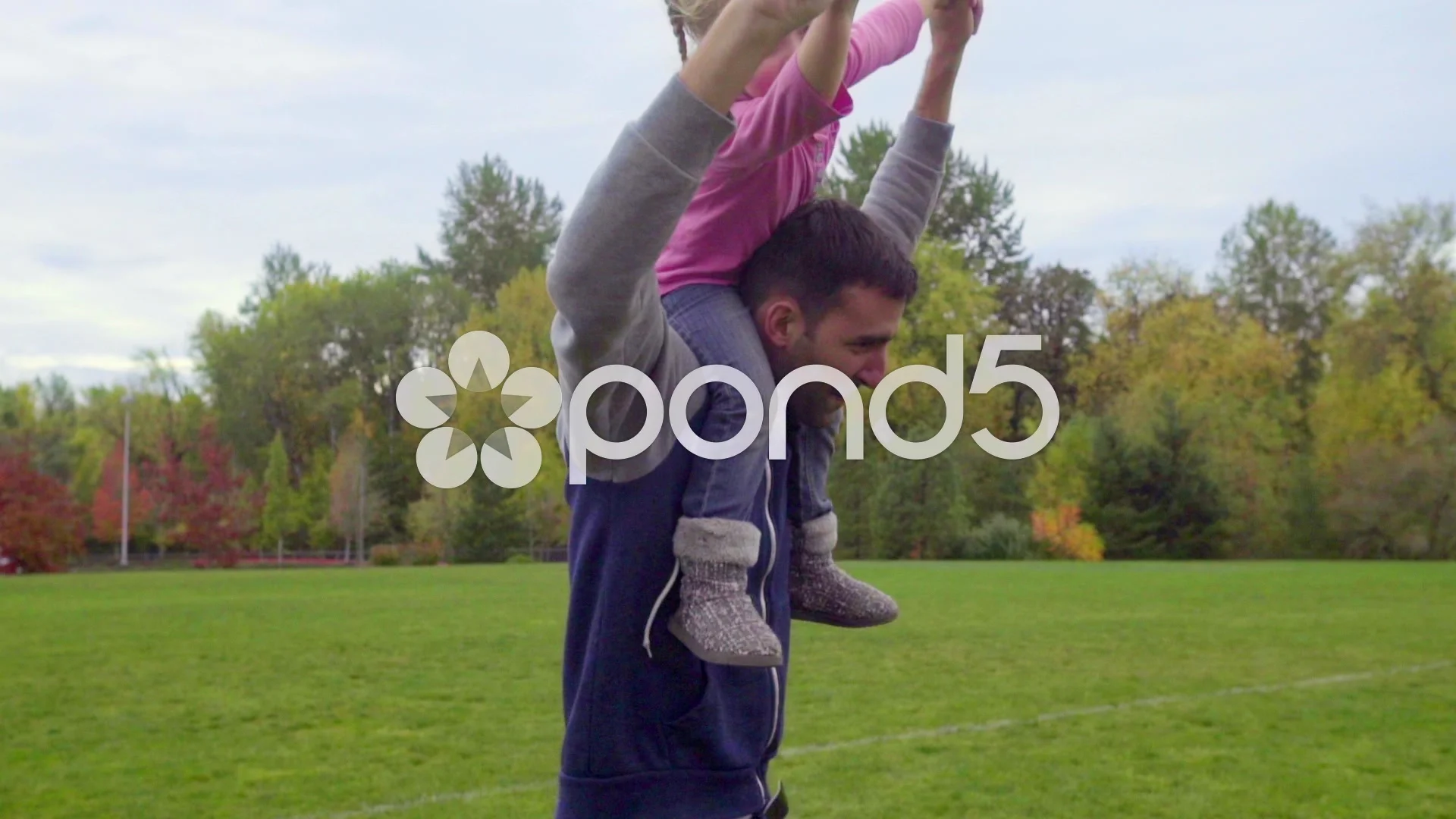 Daughter enjoys riding dads shoulders