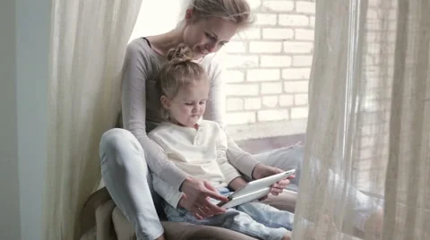 Daughter with mother using tablet Stock Footage 56181344