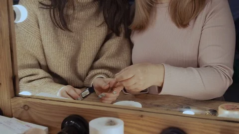 Daughter teaches mom how to do makeup Video stock 129016722