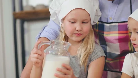 Daughters help to make breakfast Stock Footage 116329945
