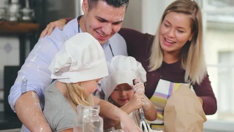 Daughters help parents making breakfast Stock Footage 116331764