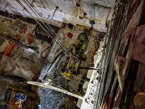 Davconstruction machine in a basement ..of a construction site davconstructio Stock Photos