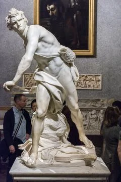David prepared to throw a stone at Goliath Stock Photos