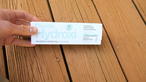 Davids Hydroxi toothpaste brand label with hydroxyapatite tube in box Stock Footage 321990565