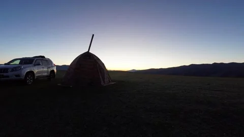 Dawn among green fields and hills. Camping Stock Footage 250811948