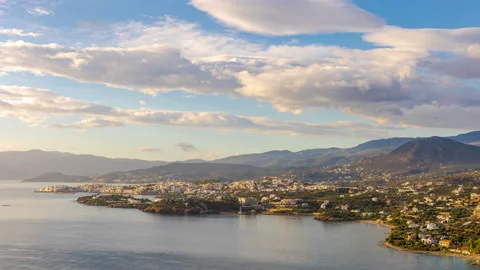 Dawn and the movement of clouds over Agios Nikolaos, Crete, Greece Stock Footage 220735141