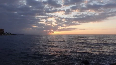 Dawn between clouds over the sea Stock Footage 283276171