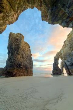 Dawn between curious sea cliffs Stock Photos