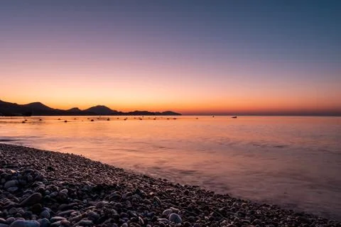 Dawn of the black sea on the beach Stock Photos