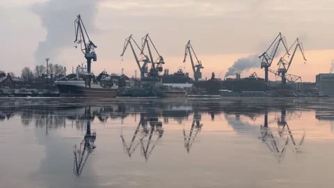 Dawn Breaks over Serene Industrial Harbor Stock Footage 257441117