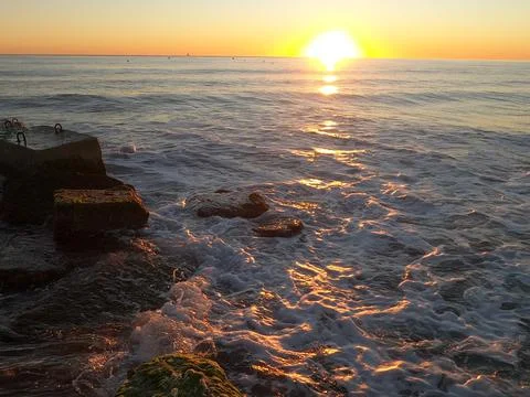 Dawn on the breakwater Stock Photos