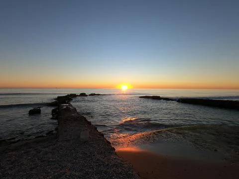 Dawn breakwater Stock Photos