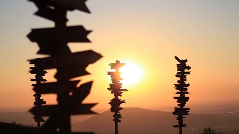 Dawn, A bright disc of the sun rises over the horizon between wooden plates Stock Footage 127734725