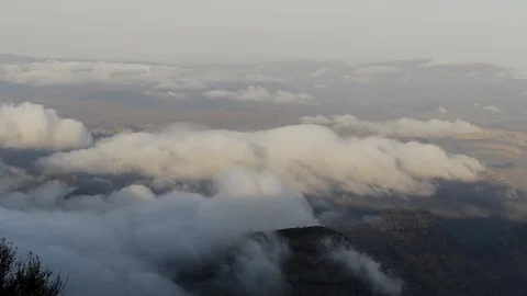 Dawn clouds falling over the Drakonsberg Mountains, South Africa Stock Footage 125956362