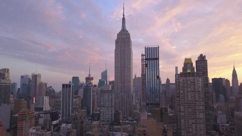 Dawn flying higher backward view of Empire State Building Stock Footage 94197793