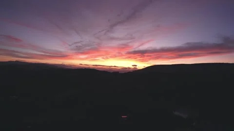 Dawn in front of temple gate with impressive colorful clouds in sky Stock Footage 147063606