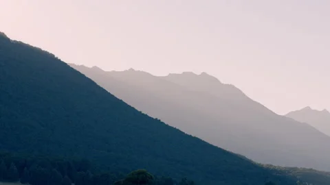 Dawn light across mountain range hand-held Stock Footage 196813025