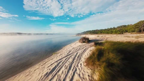Dawn mist glides over calm waters Stock Footage 340904414