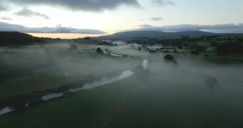 Dawn in a misty valley Stock Footage 321601476