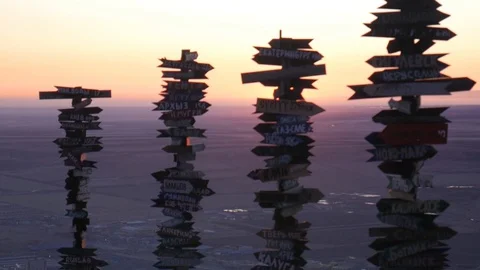 Dawn on the mountain. Sun disk rises from the horizon between wooden plates Stock Footage 127734392