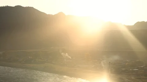 Dawn in the mountains. Mountain river and the sun's rays Stock-Footage 102436771