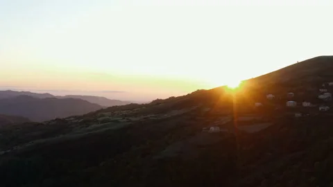 Dawn in the mountains. Sun rises from behind the mountains. Nature is awakening. Stock Footage 143993649