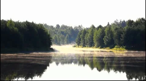 Dawn over the lake Stockbeeldmateriaal 9821053