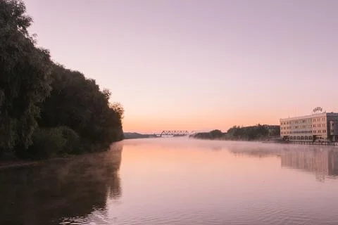 Dawn over a misty river Stock Photos