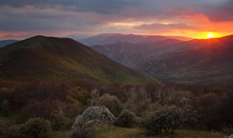 Dawn over the mountains with clouds Stock Photos