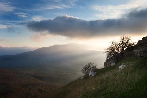 Dawn over the mountains with clouds Stock Photos