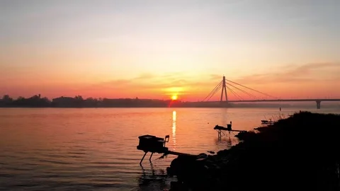 Dawn over the river with a view of the bridge in Kyiv Stock Footage 259705373