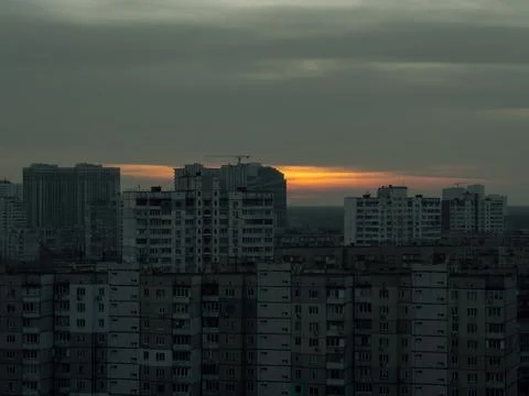 Dawn over the roofs of old panel houses. Stock Photos