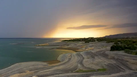 Dawn on the peninsula, the sun rises under variable cloudiness Stock Footage 310666002