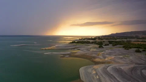 Dawn on the peninsula, the sun rises under variable cloudiness Stock Footage 310666159