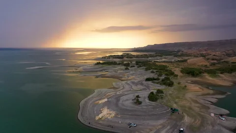 Dawn on the peninsula, the sun rises under variable cloudiness Stock Footage 310666260