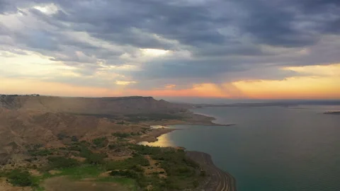 Dawn on the peninsula, the sun rises under variable cloudiness Stock Footage 310666435