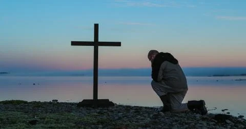 Dawn praying man Stock Photos