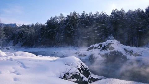 Dawn rays over the lake in the winter forest Stock Footage 72634800