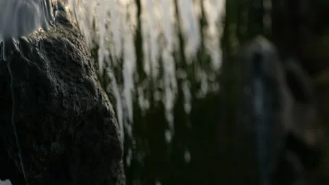 The dawn is reflected in the dark water on the river. Slow motion. Vertical Stock Footage 205546526