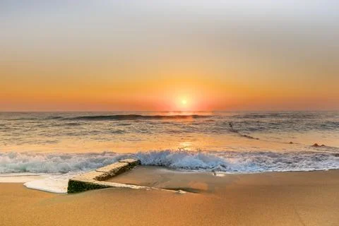 Dawn by the sea Stock Photos