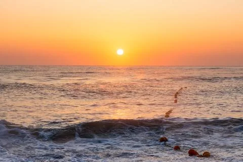Dawn by the sea Stock Photos