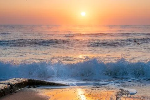 Dawn by the sea Stock Photos