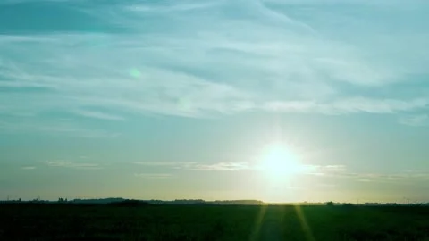 Dawn, Shining Sun, Blue Clear Sky and Light Cirrus Clouds in the Field, Time Lap Stock Footage 156859110
